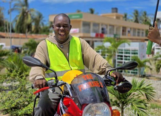 African small business owner working in a business supported by financial services.